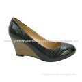 Dress shoes in various colors and designs, with man-made snake skin upper and wedge heel